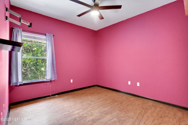 1601 Majestic View Ln, Fleming Island, FL 32003 - empty room with wood finished floors and ceiling fan