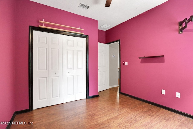 1601 Majestic View Ln, Fleming Island, FL 32003 - unfurnished bedroom featuring wood finished floors, a closet, and ceiling fan