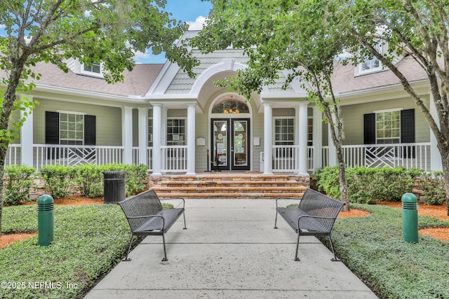 1601 Majestic View Ln, Fleming Island, FL 32003 - view of exterior entry featuring covered porch and roof with shingles