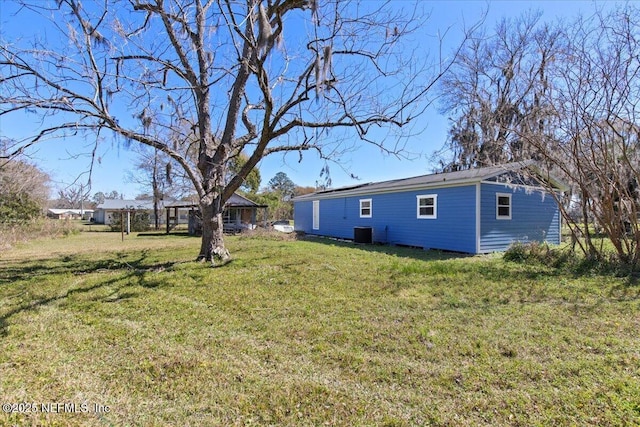 view of yard featuring central AC unit