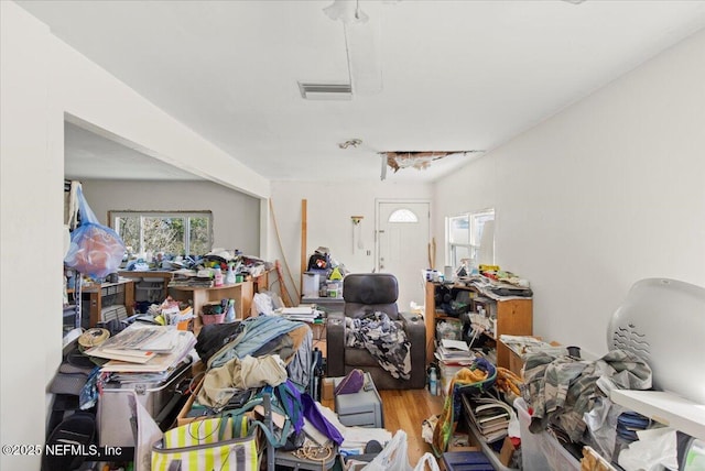 interior space featuring wood finished floors and visible vents