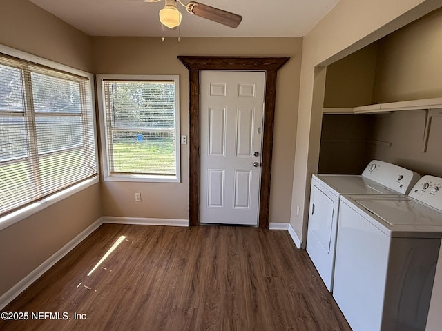 washroom featuring dark wood-type flooring, baseboards, ceiling fan, laundry area, and washer and dryer