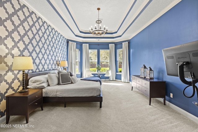 carpeted bedroom with baseboards, an inviting chandelier, crown molding, a textured ceiling, and a raised ceiling