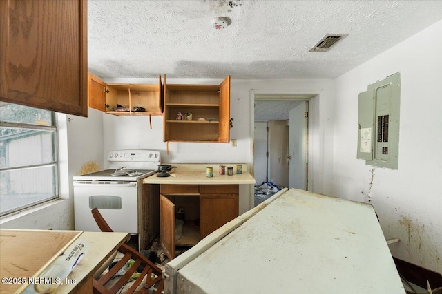 kitchen with visible vents, white range with electric cooktop, electric panel, brown cabinetry, and open shelves