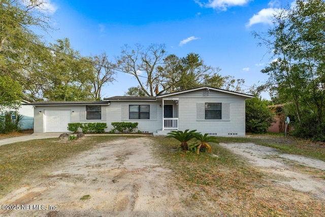 ranch-style home with an attached garage and driveway