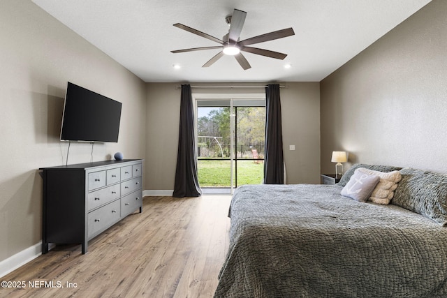 bedroom featuring access to exterior, a ceiling fan, light wood-type flooring, and baseboards