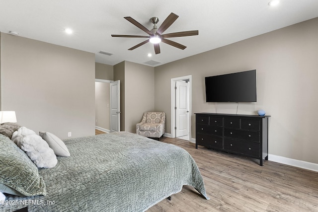 bedroom featuring wood finished floors, visible vents, baseboards, recessed lighting, and ceiling fan