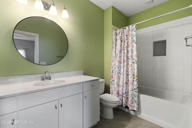 full bath with tile patterned floors, toilet, vanity, and shower / bath combo