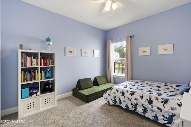 carpeted bedroom featuring a ceiling fan and baseboards