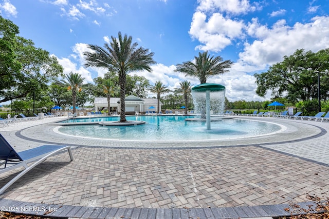 community pool with a patio area