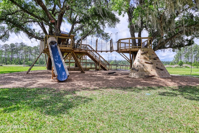 view of play area with stairs and a yard