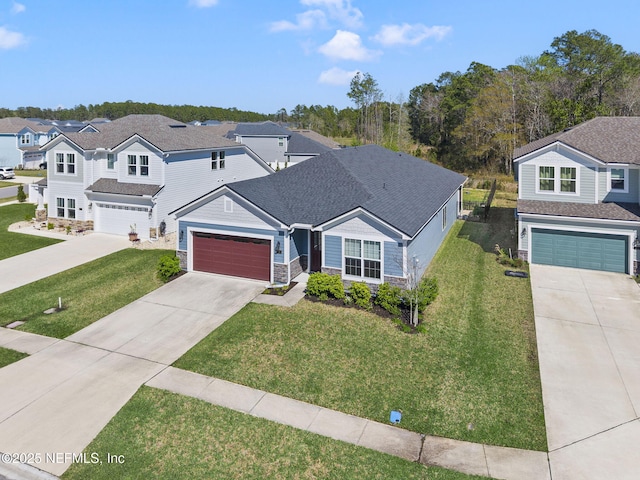 traditional-style home with an attached garage, concrete driveway, a front lawn, stone siding, and a residential view