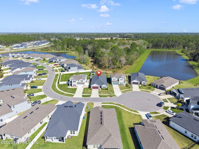 drone / aerial view with a residential view and a water view