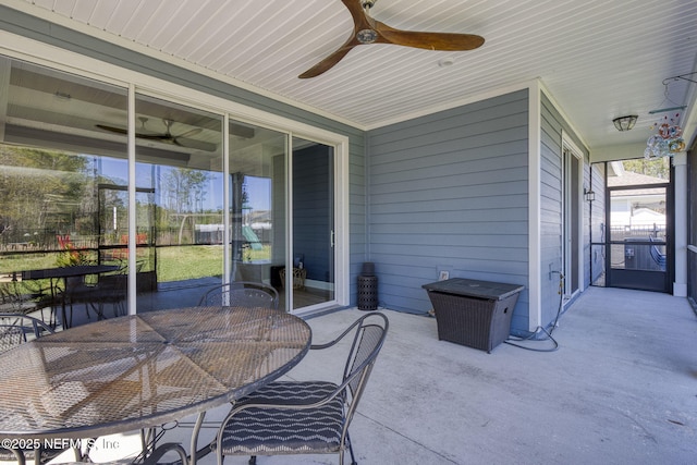 sunroom with a ceiling fan