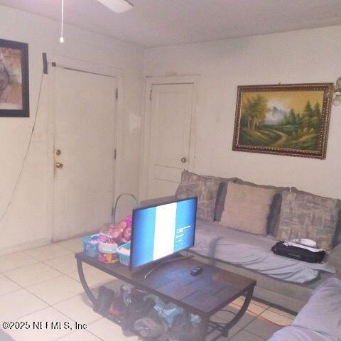 living area with light tile patterned floors