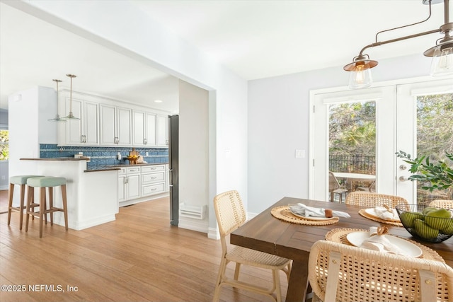 dining space with light wood-style floors