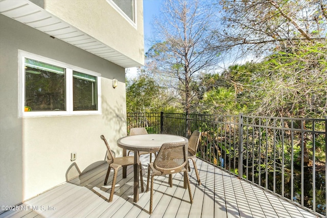 wooden deck with outdoor dining area