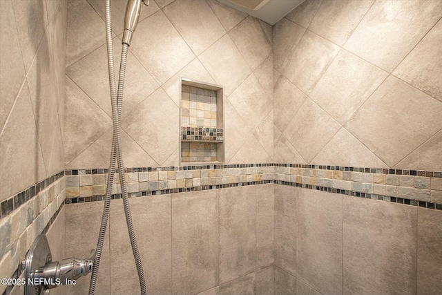 room details with a tile shower