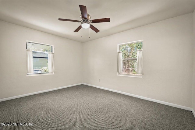 unfurnished room with baseboards, ceiling fan, and carpet flooring