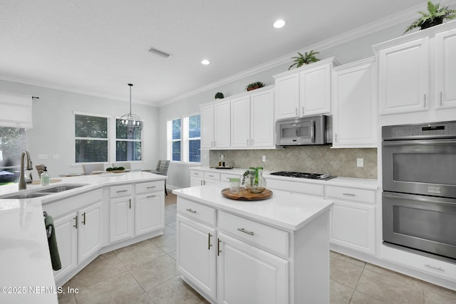 163 Medio Dr, Saint Augustine, FL 32095 - kitchen with a sink, tasteful backsplash, visible vents, and stainless steel appliances