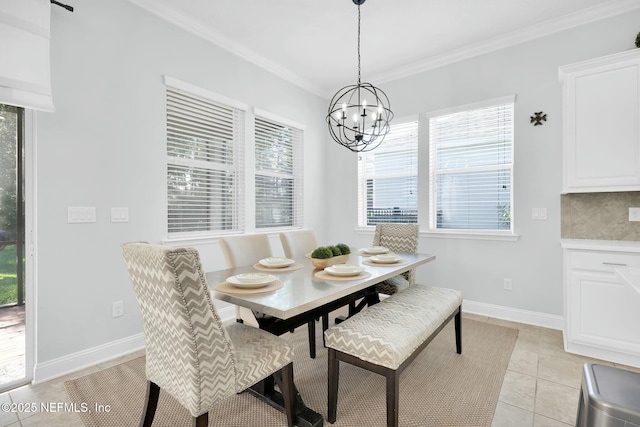 163 Medio Dr, Saint Augustine, FL 32095 - dining room featuring light tile patterned floors, baseboards, a notable chandelier, and crown molding
