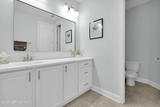 163 Medio Dr, Saint Augustine, FL 32095 - bathroom featuring tile patterned floors, toilet, vanity, and baseboards