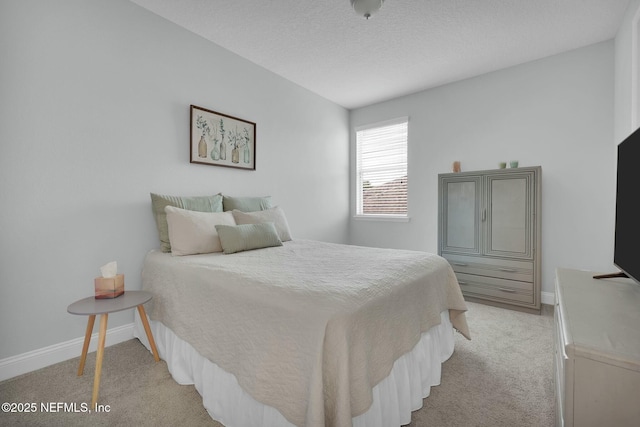 163 Medio Dr, Saint Augustine, FL 32095 - bedroom with a textured ceiling, baseboards, and light carpet