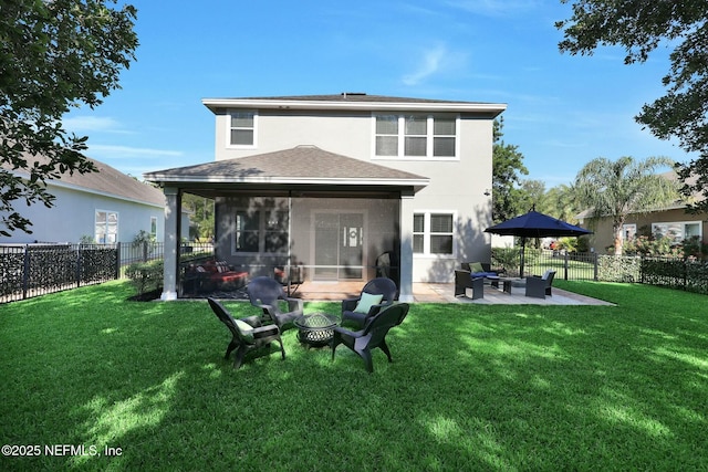 163 Medio Dr, Saint Augustine, FL 32095 - back of property with an outdoor fire pit, a sunroom, a yard, a fenced backyard, and a patio area