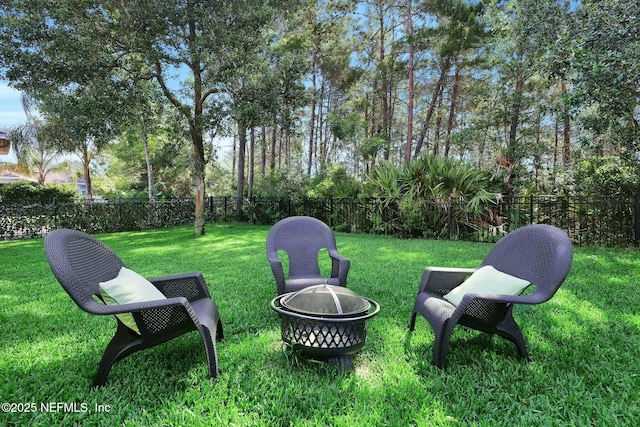 163 Medio Dr, Saint Augustine, FL 32095 - view of yard featuring a fire pit and fence