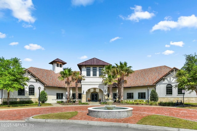 163 Medio Dr, Saint Augustine, FL 32095 - view of front of home featuring a tile roof, stucco siding, and curved driveway