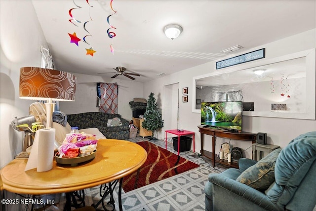 living room with visible vents and ceiling fan