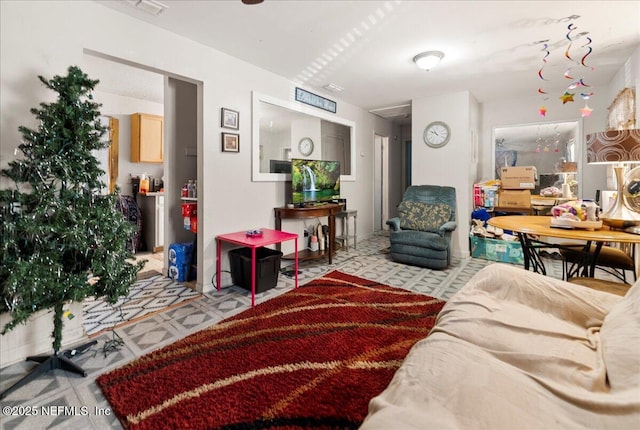 living area featuring tile patterned floors