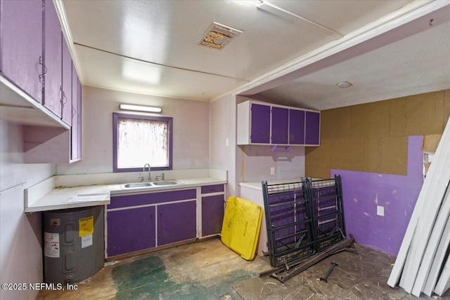 kitchen featuring a sink and light countertops