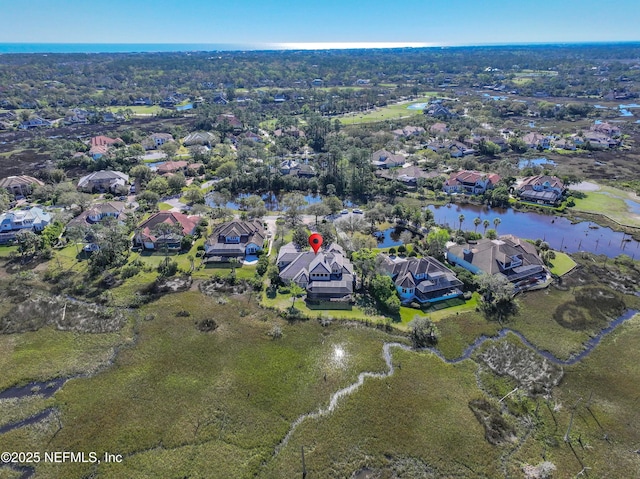 birds eye view of property featuring a residential view and a water view