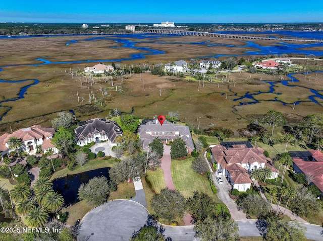 bird's eye view featuring a residential view and a water view