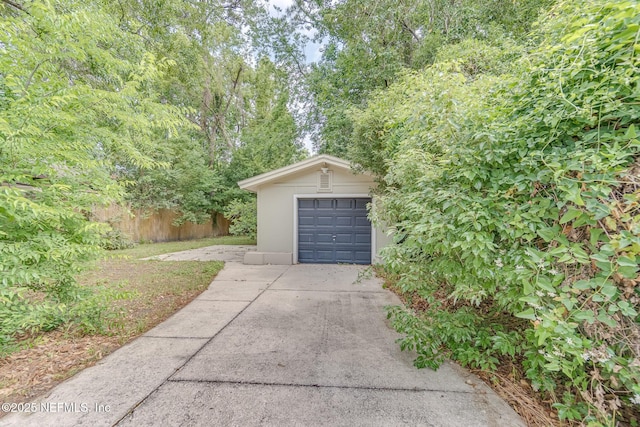 4059 College St, Jacksonville, FL 32205 - garage featuring fence and driveway