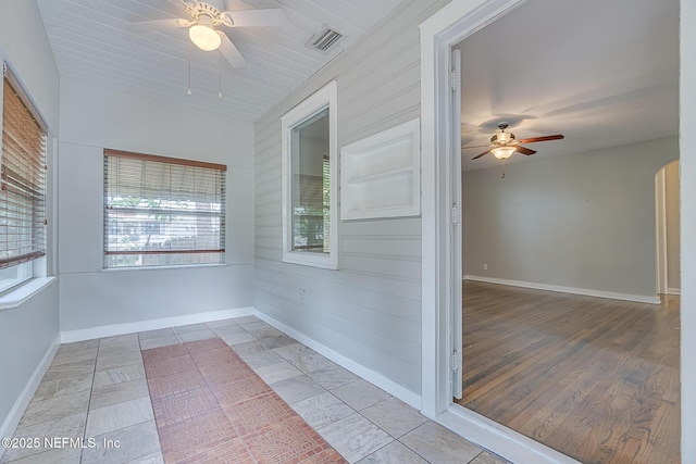 4059 College St, Jacksonville, FL 32205 - unfurnished sunroom featuring arched walkways and visible vents
