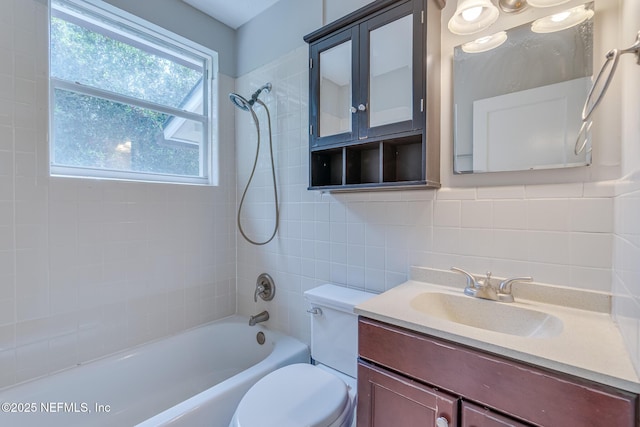 4059 College St, Jacksonville, FL 32205 - bathroom with vanity, toilet, tile walls, washtub / shower combination, and tasteful backsplash