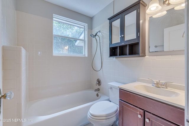 4059 College St, Jacksonville, FL 32205 - full bath with vanity, shower / bathtub combination, toilet, tile walls, and tasteful backsplash