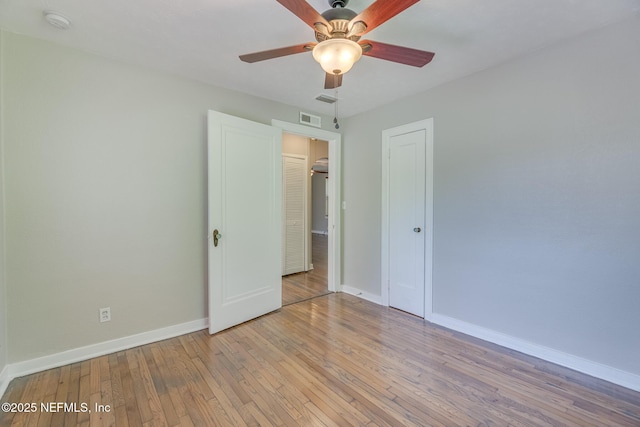 4059 College St, Jacksonville, FL 32205 - unfurnished bedroom with baseboards, a ceiling fan, light wood-style flooring, and visible vents