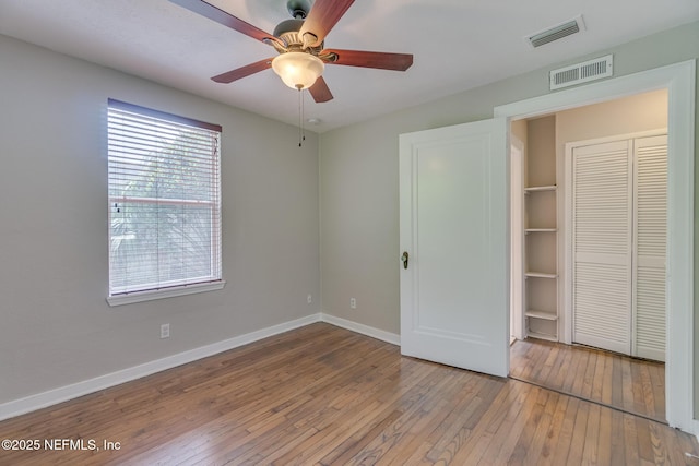 4059 College St, Jacksonville, FL 32205 - unfurnished bedroom with visible vents, wood-type flooring, and baseboards