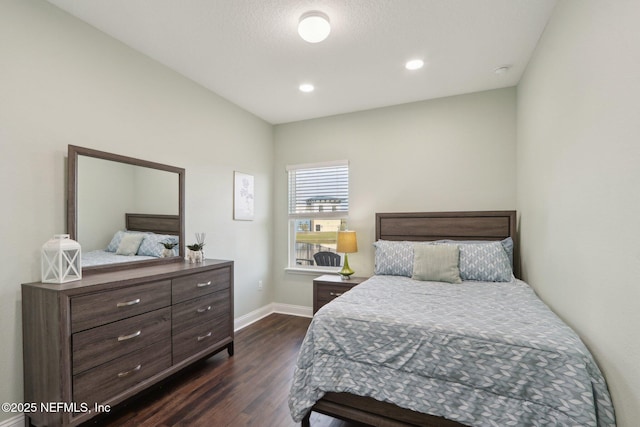 bedroom featuring dark wood-type flooring, recessed lighting, and baseboards