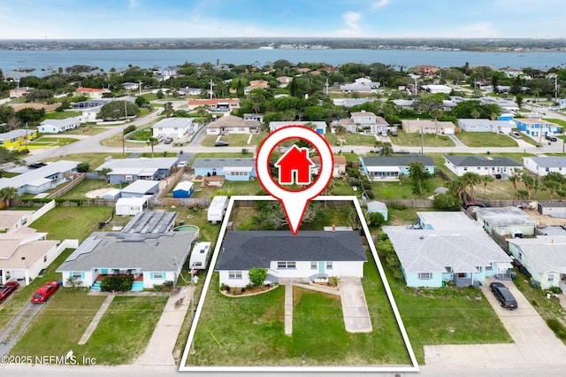 bird's eye view with a residential view and a water view