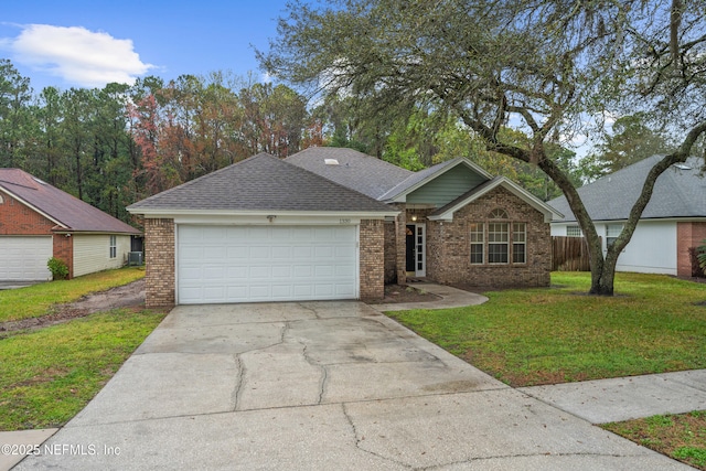 ranch-style home with a front yard, an attached garage, brick siding, and driveway