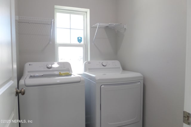 laundry area featuring laundry area and separate washer and dryer