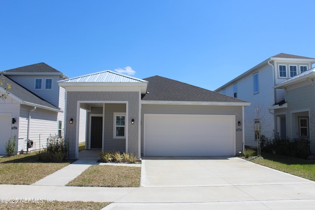 view of front of house with a garage and concrete driveway