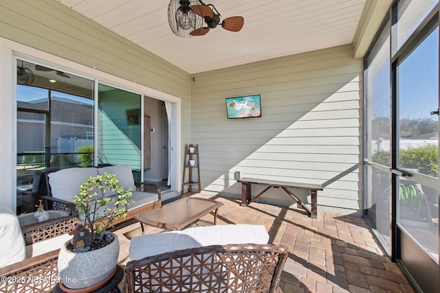 sunroom / solarium with ceiling fan