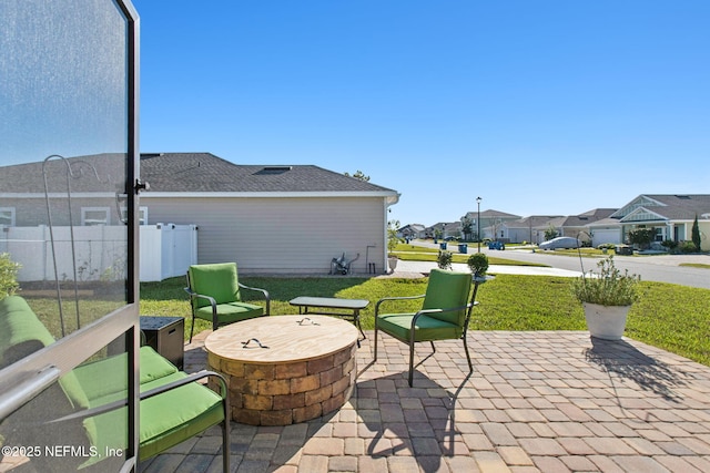 view of patio / terrace with a residential view and fence