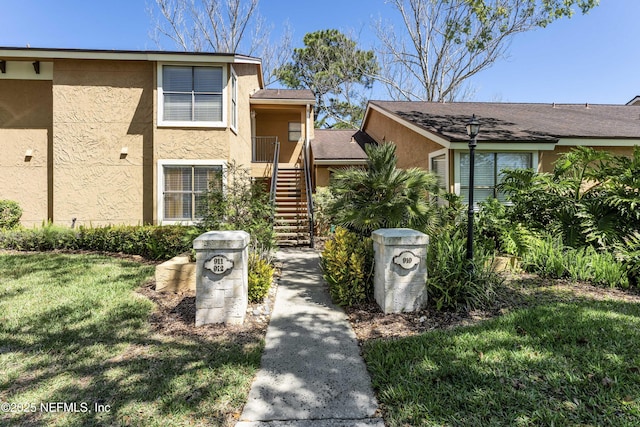 view of property featuring stairs