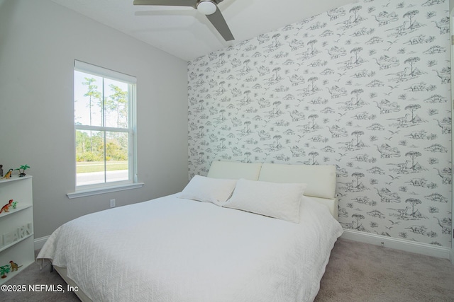 carpeted bedroom featuring ceiling fan, wallpapered walls, and baseboards